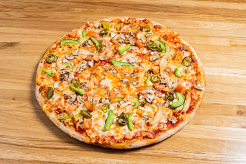 pizza on the wooden background