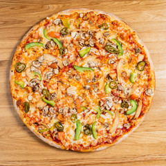 pizza on the wooden background