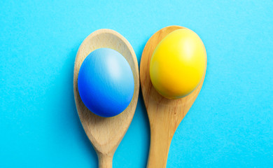 Happy Easter holiday in Ukrainian language card, Easter eggs as the color of the Ukraine flag