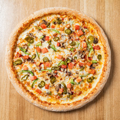 tasty pizza on the wooden table