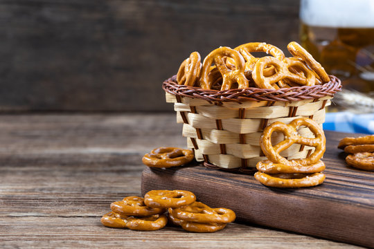 Beer snack for a party - salted hard pretzels on a wooden table