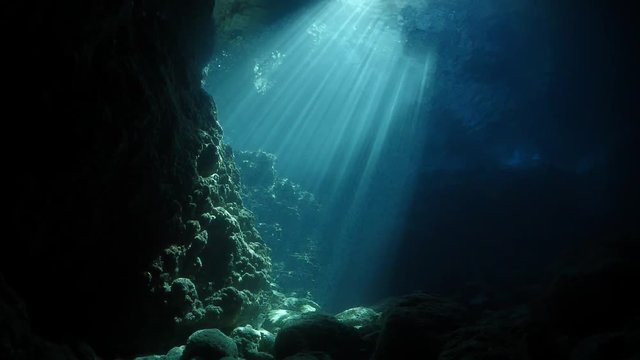 sun beam and rays sun shine underwater in caves and caverns scenery