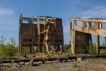 Ruins of abandoned mining headframe buidings