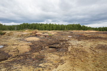Dull landscape on abandoned mining site with surface dump