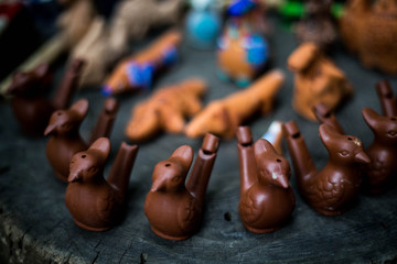 Handmade whistles different animal shapes. Dog and Hippo.