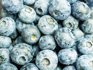 Closeup photo of a scattering of delicious blueberry berries
