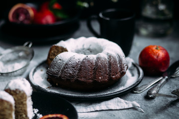 cake with red orange on a dark background