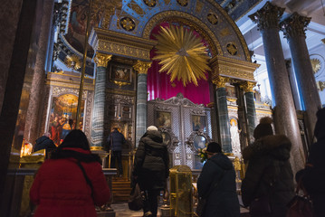 Saint Petersburg, Russia: believers stand in line in front of icons in Kazan Cathedral. The...