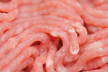 Raw and red mincemeat close up with white fat spots in it