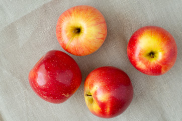 Fresh juicy apples on linen background. Apples on cloth.