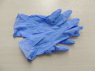 Blue gloves on the table