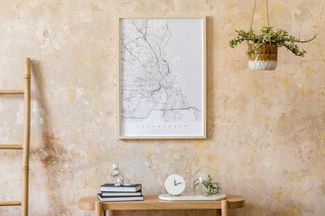 Stylish composition of living room with design wooden console, ladder, books, plant, clock, air plant, decoration, grunge wall and elegant personal accessories in modern home decor.