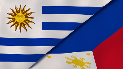 Obraz premium The flags of Uruguay and Philippines. News, reportage, business background. 3d illustration