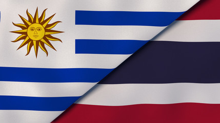 The flags of Uruguay and Thailand. News, reportage, business background. 3d illustration