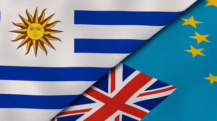 The flags of Uruguay and Tuvalu. News, reportage, business background. 3d illustration