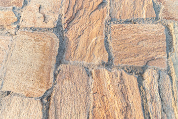 The texture of the paved tile of the street. Concrete paving slabs.