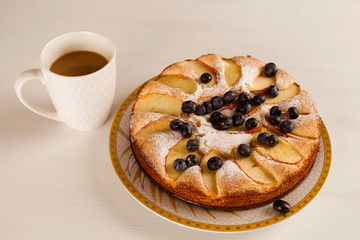 Breakfast time with coffee and big tasty pie on table