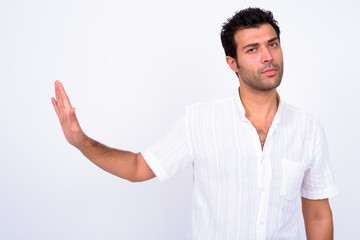 Fototapeta premium Portrait of serious Turkish man with stop gesture