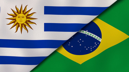 The flags of Uruguay and Brazil. News, reportage, business background. 3d illustration