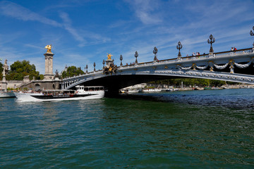 The Bridge over the River Seine - Alexandre III Bridge in Paris, France - and tour boat, August 1, 2015