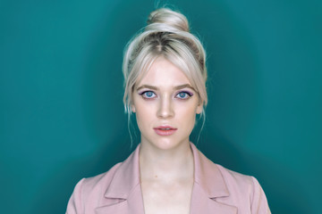 Shadowless light, portrait. Sexy young blonde looking at the camera.