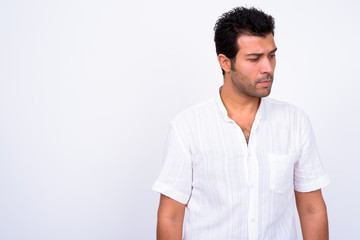 Portrait of stressed Turkish man looking down