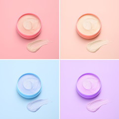 Jars of cream on color background