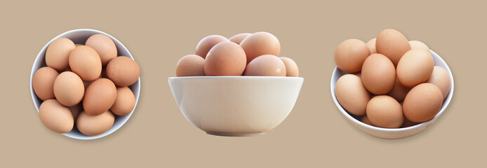 Brown chicken eggs in a white bowl on Brown background