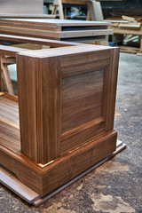 Fototapeta na wymiar Dresser elements in a workshop. Solid wood chest of drawers. Furniture manufacture
