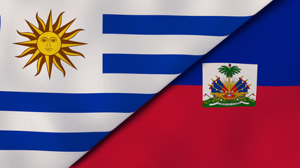 The flags of Uruguay and Haiti. News, reportage, business background. 3d illustration