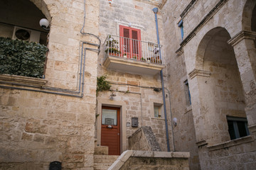 Beautiful italian streets and yards of Polignano a Mare summer time touristic destination
