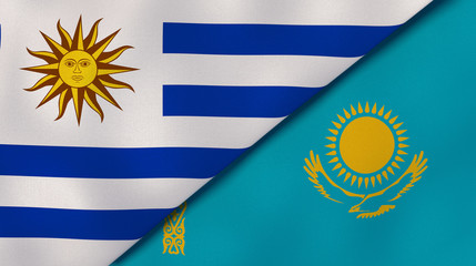 Fototapeta premium The flags of Uruguay and Kazakhstan. News, reportage, business background. 3d illustration