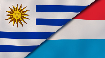Fototapeta premium The flags of Uruguay and Luxembourg. News, reportage, business background. 3d illustration