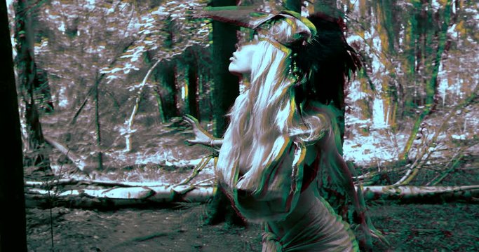 sexy woman looks like wild mad witch is listening sounds in woodland, psychedelic visual effect