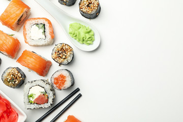 Sushi rolls and chopsticks on white background, space for text. Japanese food