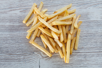 french fries on wooden table