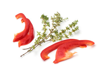 Sliced sweet bell pepper, aromatic herbs thyme, close-up on a white background, isolate, copy space.