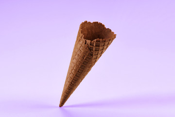 Empty, tasty, chocolate wafer cone for ice cream isolated on white. Concept of food, treats. Mockup, template for advertising and design. Close up