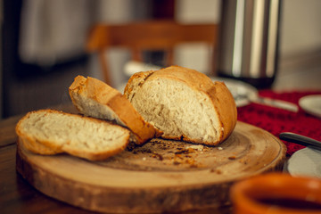 Breakfast table wood with coffee cups and hot bread.