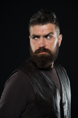 Treating your beard with care. Bearded man dark background. Skin and hair care routine. Skincare and haircare products. Barbershop. Mens grooming and care. Health and care