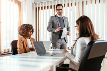 Business manager assigns project tasks to colleagues