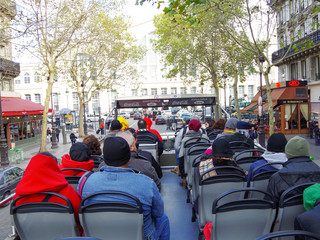 
sightseeing bus on the streets of Paris