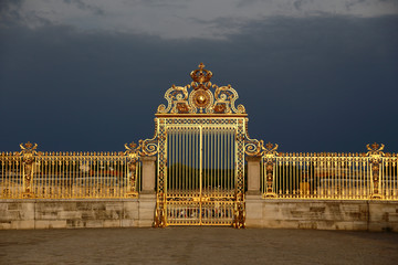 VERSAILLES, FRANCE - August 8, 2015: Main golden gates of the chateau de Versailles, Versailles,...