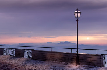 lamp at sunset in nature valley and snow