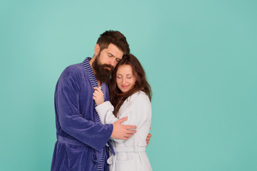 Sleepy people blue background. Couple in love bathrobes. Drowsy and weak in morning. Advice relationships surviving quarantine. Morning routine. Couple sleepy faces domestic clothes. All day pajamas