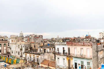 Fototapeta na wymiar View from the rooftop in Old Havana with lots of ruin building and sky