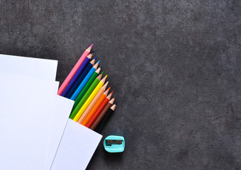 Set for drawing, color pencils, paper. View from above. Office tools.