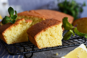 Lemon cake with zest on a concrete background. View from above.