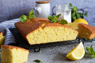 Lemon cake with zest on a concrete background. View from above.