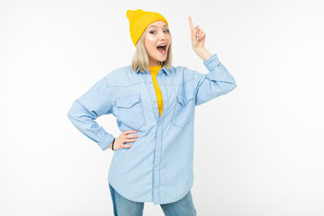 blond joyful girl shows thumb up on a white background isolated